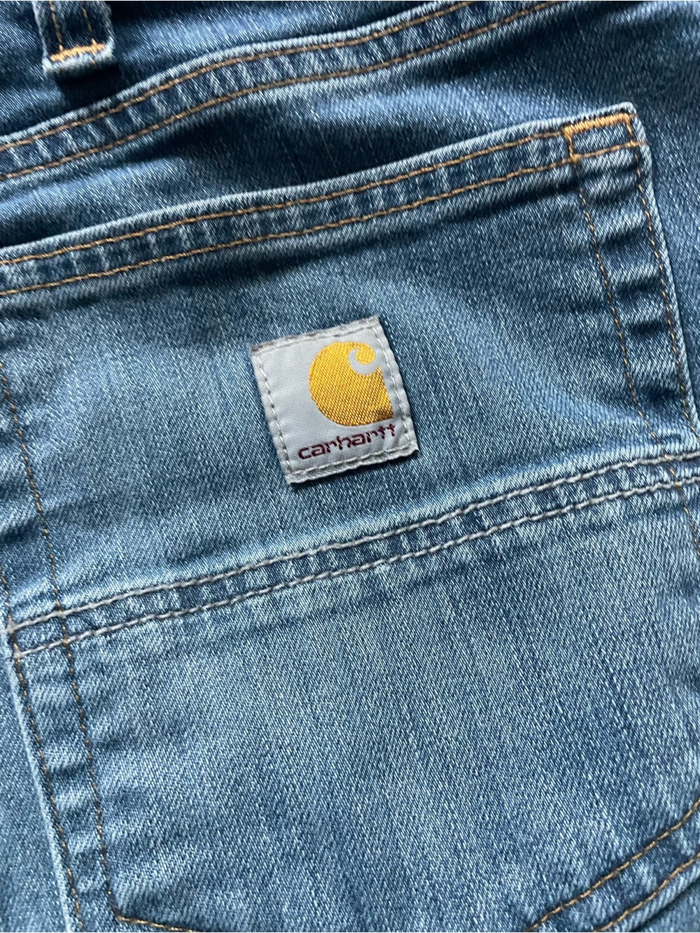 Carhartt Men’s Light Blue Denim Jeans with Yellow Logo Patch